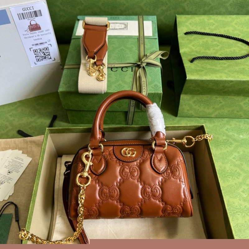 G*u*i top handle bags